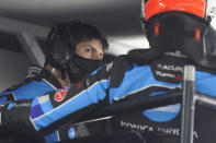 Ricky Taylor, left, talks with driving teammate Alexander Rossi in their pit stall during a practice session for the Rolex 24 hour race at Daytona International Speedway, Friday, Jan. 29, 2021, in Daytona Beach, Fla. (AP Photo/John Raoux)