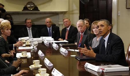U.S. President Barack Obama meets with health insurance chief executives at the White House in Washington November 15, 2013 file photo. REUTERS/Kevin Lamarque