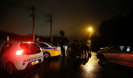 Police officers block a road close to the area of the B3/B4 mine operated by Vale SA that was evacuated, in Nova Lima, Brazil February 16, 2019. REUTERS/Cristiane Mattos