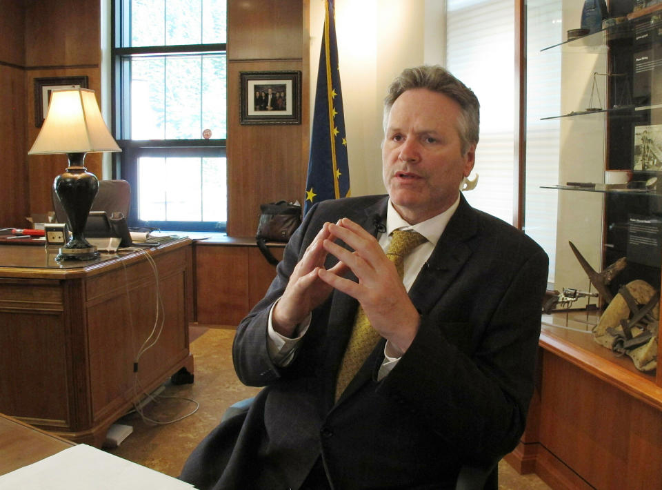 FILE - In this May 29, 2019, file photo, Alaska Gov. Mike Dunleavy speaks to reporters in his office at the state Capitol in Juneau, Alaska. A fight is brewing over whether Dunleavy, a Republican who took office in Dec. 2018, should be recalled. Critics say he’s incompetent and has recklessly tried to cut spending while supporters see a politically motivated attempt to undo the last election. (AP Photo/Becky Bohrer, File)