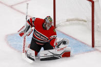 Chicago Blackhawks goaltender Petr Mrazek (34) makes a glove-save during the first period of an NHL hockey game against the Boston Bruins, Saturday, Nov. 19, 2022, in Boston. (AP Photo/Mary Schwalm)