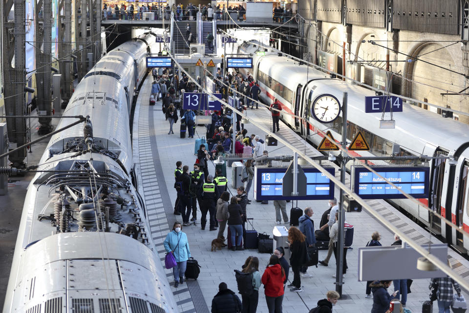 "Stay train" is written on display boards at Hamburg Central Station after long-distance traffic in northern Germany came to a standstill in Hamburg, Germany, Saturday, Oct.8, 2022. According to Deutsche Bahn, a technical malfunction is currently causing a complete standstill in long-distance traffic in northern Germany. All ICE as well as IC and EC trains in northern Germany are affected, Deutsche Bahn announced on Saturday morning. (Bodo Marks/dpa via AP)