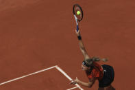 Karolina Muchova of the Czech Republic serves against Russia's Anastasia Pavlyuchenkova during their quarter final match of the French Open tennis tournament at the Roland Garros stadium in Paris, Tuesday, June 6, 2023. (AP Photo/Aurelien Morissard)