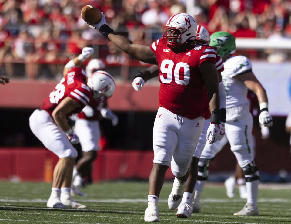 Nebraska's Stephon Wynn Jr. (90) celebrates after recovering a fumble by North Dakota quarterback Tommy Schuster, who was sacked by Garrett Nelson during the second half of an NCAA college football game Saturday, Sept. 3, 2022, in Lincoln, Neb. Nebraska won 38-17. (AP Photo/Rebecca S. Gratz)