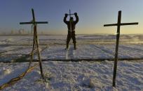 A worker stabs an iron pike into the frozen Songhua River as he takes giant ice cubes to make sculptures for the upcoming 30th Harbin Ice and Snow Festival, in Harbin, Heilongjiang province December 27, 2013. Each ice cube weighs about 250 kilograms (551 lb). According to the festival organizers, nearly 10,000 workers were employed to build the ice and snow sculptures, which require about 180,000 square metres of ice and 150,000 square metres of snow. The festival kicks off on January 5, 2014. REUTERS/Sheng Li (CHINA - Tags: ENVIRONMENT SOCIETY BUSINESS EMPLOYMENT TRAVEL) CHINA OUT. NO COMMERCIAL OR EDITORIAL SALES IN CHINA