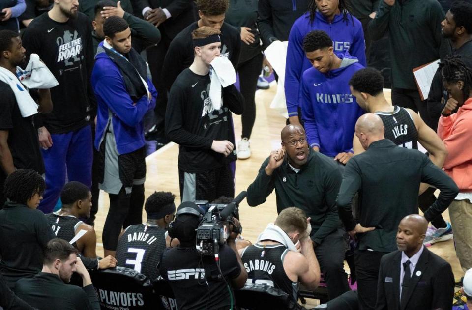 Sacramento Kings coach Mike Brown talks to players during a timeout during Game 7 of the first-round NBA playoff series at Chase Center on Sunday, April 30, 2023.