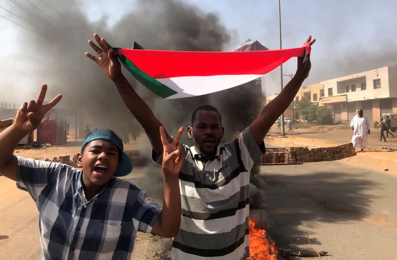 Protesters block a road in Khartoum