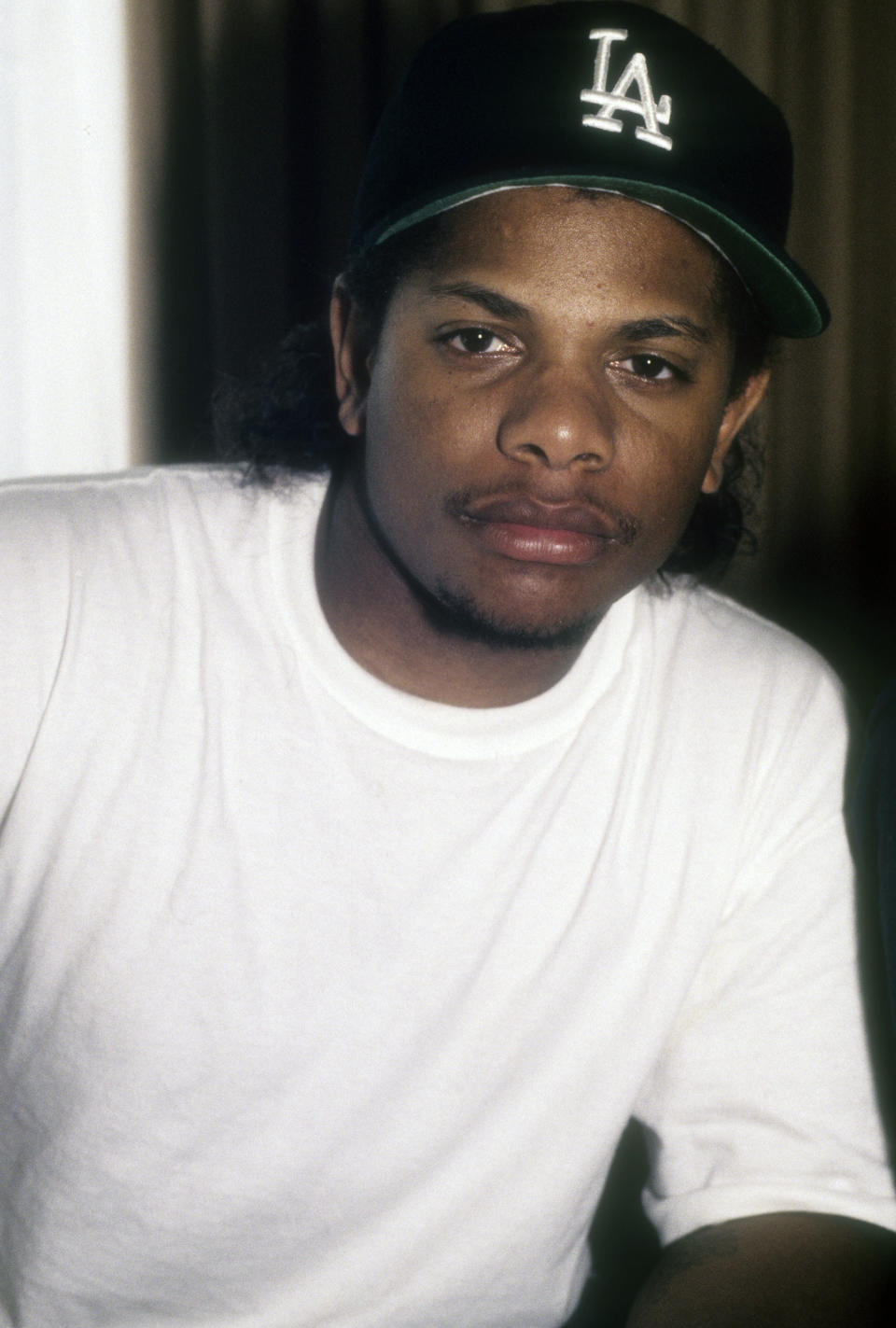 Eazy-E Wearing White T-Shirt And Los Angeles Dodgers Hat