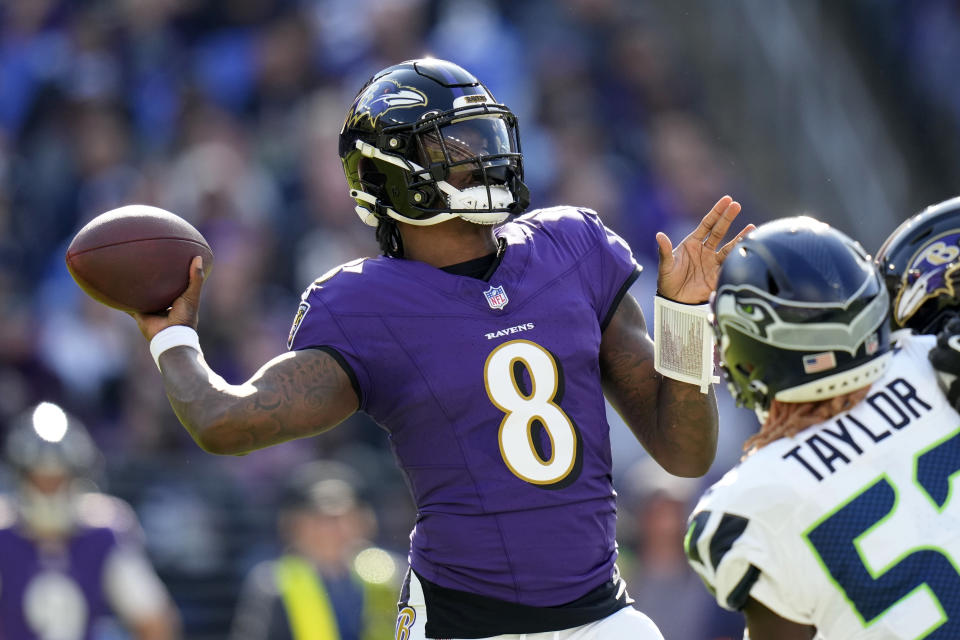 Baltimore Ravens quarterback Lamar Jackson (8) throws a pass during the first half of an NFL football game against the Seattle Seahawks, Sunday, Nov. 5, 2023, in Baltimore. (AP Photo/Alex Brandon)