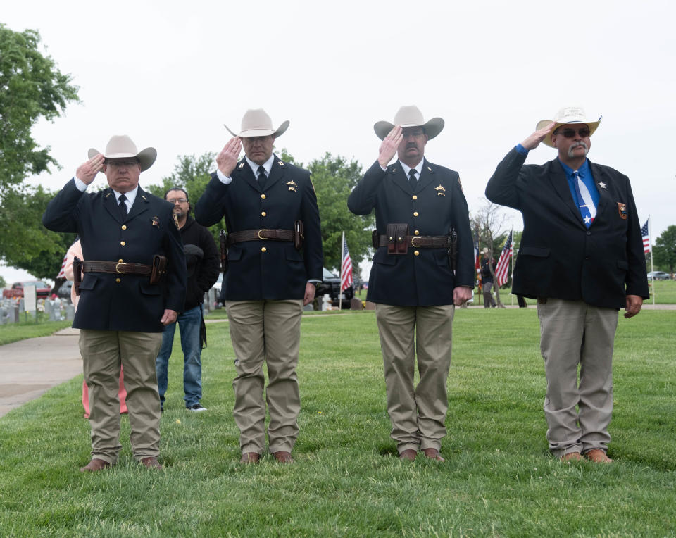 Members of Randall County Sheriff's Department  salute the fallen  Monday at an Amarillo area Police Memorial Day event at Llano Cemetery in Amarillo.