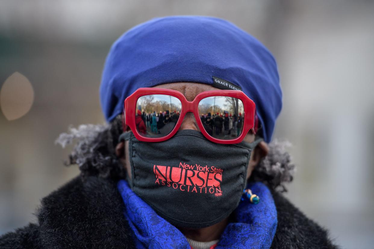 Nurses of the New York State Nurses Association attend a press conference on the Covid-19 public health crisis engulfing Jacobi Medical Center and other New York health hospital facilities on January 13, 2022 in New York City. (Photo by ANGELA WEISS / AFP) (Photo by ANGELA WEISS/AFP via Getty Images)