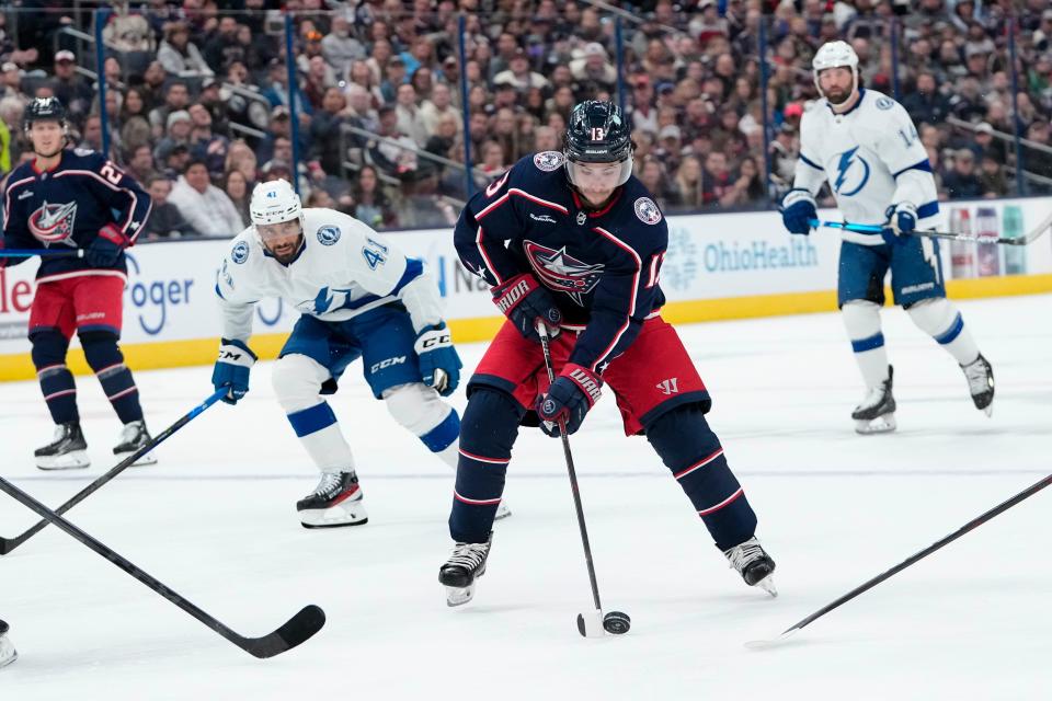 Oct 14, 2022; Columbus, Ohio, USA;  Columbus Blue Jackets left wing Johnny Gaudreau (13) brings the puck up ice during the first period of the NHL hockey game against the Tampa Bay Lightning at Nationwide Arena. Mandatory Credit: Adam Cairns-The Columbus Dispatch