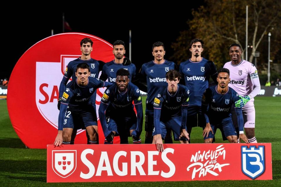 The nine players posed up for a team photo before kick off (AFP via Getty Images)