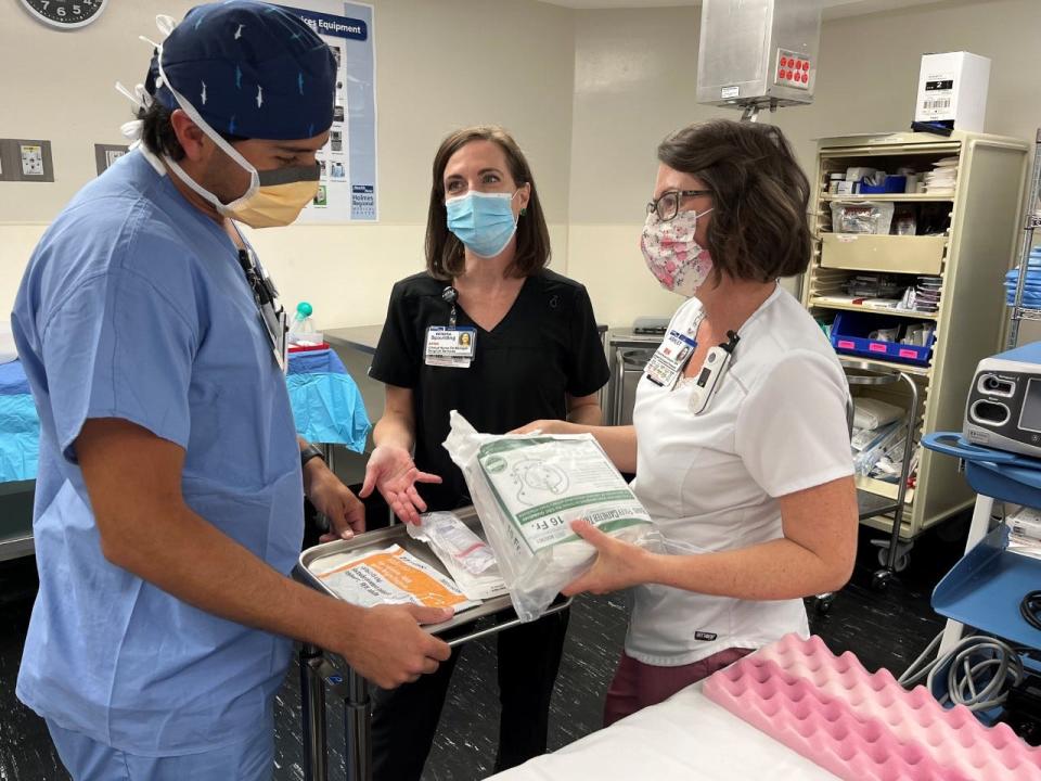 This mock training operating suite at Health First's Holmes Regional Medical Center in Melbourne, is designed to provide real-life hands-on training opportunities. From left are Noah Birch, a Health First operating room registered nurse; Kendra Spaulding, clinical nurse education manager for surgical services; and Ashley Ensenat, clinical nurse educator and coordinator for Health First's PeriOp 101 operating room nurse training program.