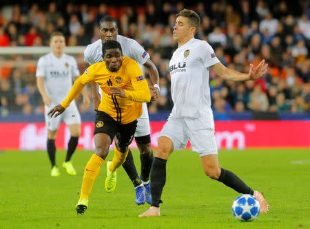 Soccer Football - Champions League - Group Stage - Group H - Valencia v Young Boys - Mestalla, Valencia, Spain - November 7, 2018 Young Boys' Roger Assale in action with Valencia's Gabriel Paulista REUTERS/Heino Kalis