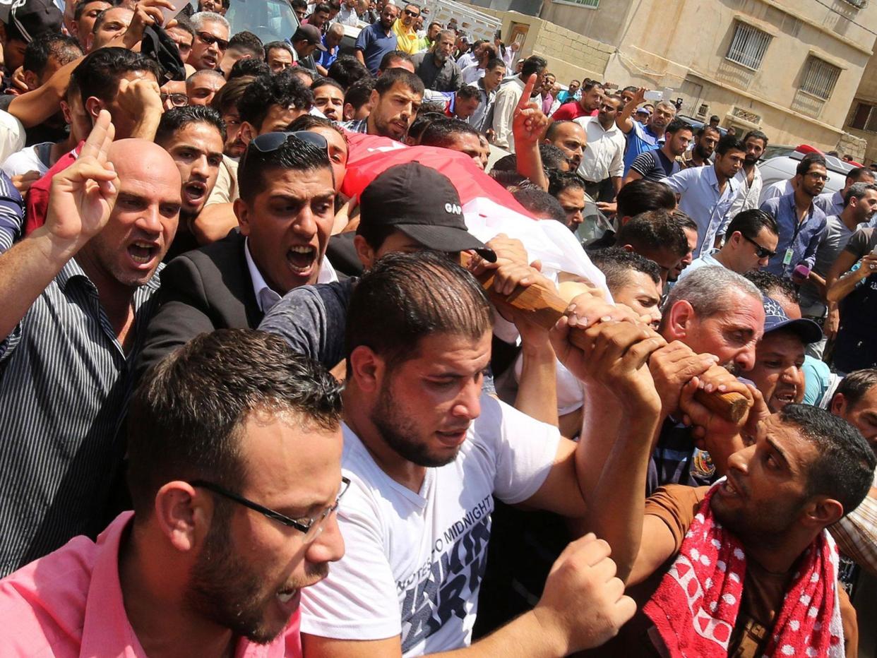 Mourners carry the body of 17-year-old Mohammed Jawawdeh: AFP/Getty Images