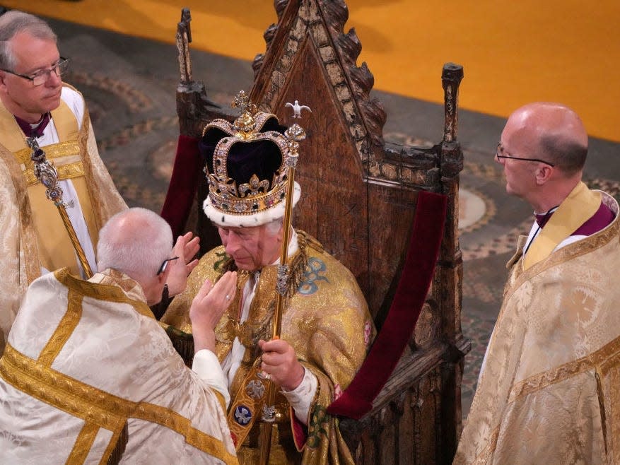 King Charles III is crowned with St Edward's Crown by The Archbishop of Canterbury the Most Reverend Justin Welby during his coronation ceremony in Westminster Abbey on May 6, 2023 in London, England.