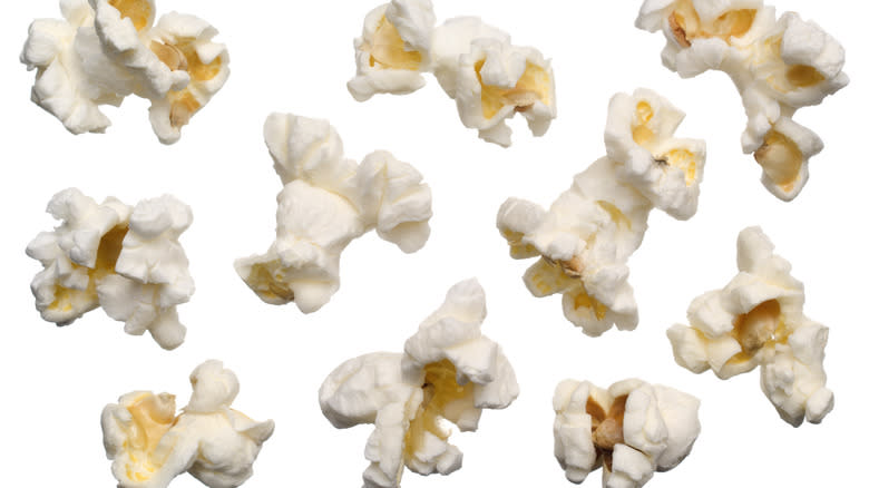 popcorn pieces against white background