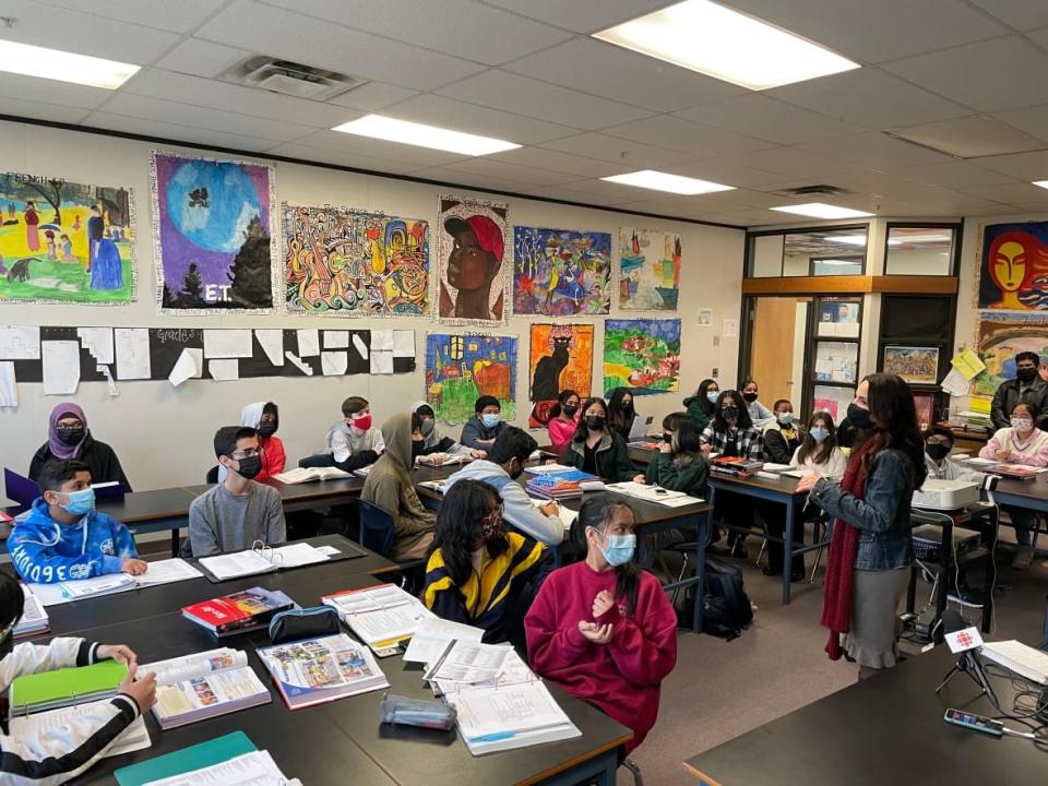 Who says teenagers are hard to wake up in the morning? Dozens of students at Johnston Heights Secondary School in Surrey, B.C., showed up before classes started Tuesday to share their frustrations over what they see as a lack of action from policy-makers on protecting them and their planet. (Jeremy Allingham/CBC - image credit)