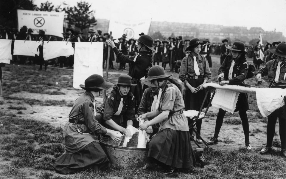 1922: Girl Guides take part in a laundry competition - Topical Press Agency/Getty Images