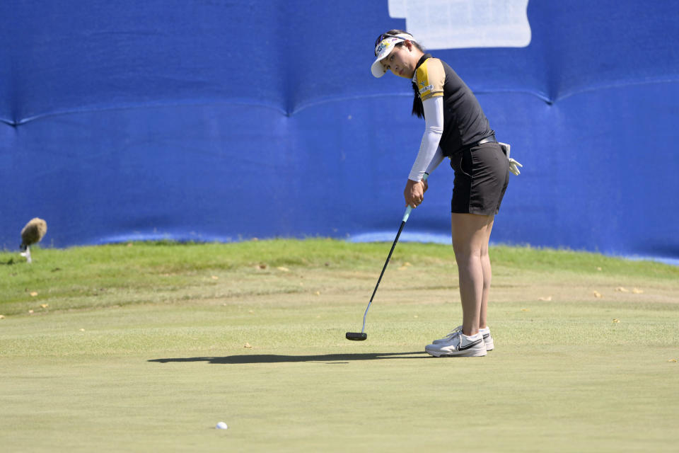 Atthaya Thitikul, of Thailand, sinks putt on the 17th hole during the final round of the LPGA Walmart NW Arkansas Championship golf tournament, Sunday, Sept. 25, 2022, in Rogers, Ark. (AP Photo/Michael Woods)