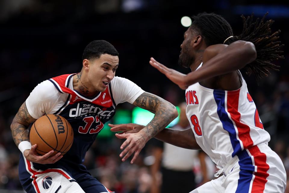 Kyle Kuzma of the Washington Wizards dribbles in front of Isaiah Stewart of the Detroit Pistons during the first half at Capital One Arena on Monday, Jan. 15, 2024 in Washington, D.C.