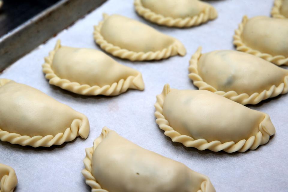 Chicken empanadas are ready for baking at Antigua Latin Inspired Kitchen on July 20. The empanadas were for the Milwaukee County Dine Out program. That day the restaurant prepared  42 meals.