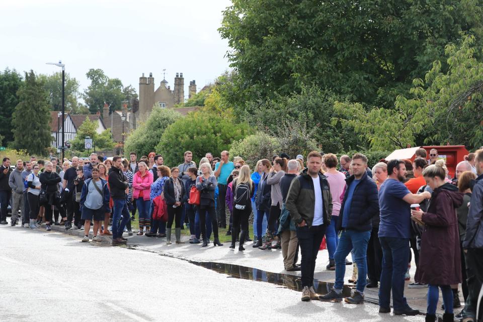 Members of the public and volunteers gather outside the fire station at Sandwich in Kent as they prepare to resume search for Lucas Dobson (PA)