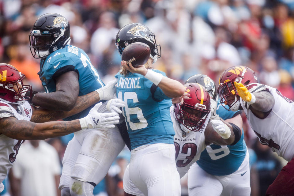 Washington Commanders defensive line pressure Jacksonville Jaguars quarterback Trevor Lawrence (16) during the first half of a NFL football game between the Washington Commanders and the Jacksonville Jaguars on Sunday, Sept. 11, 2022 at FedExField in Landover, Md. (Shaban Athuman/Richmond Times-Dispatch via AP)