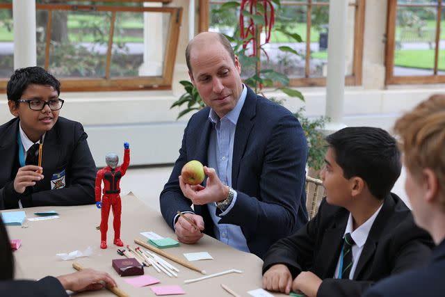 Ian Vogler-WPA Pool/Getty Prince William chats with children as he visits Kew Gardens for a Generation Earthshot event in 2021.