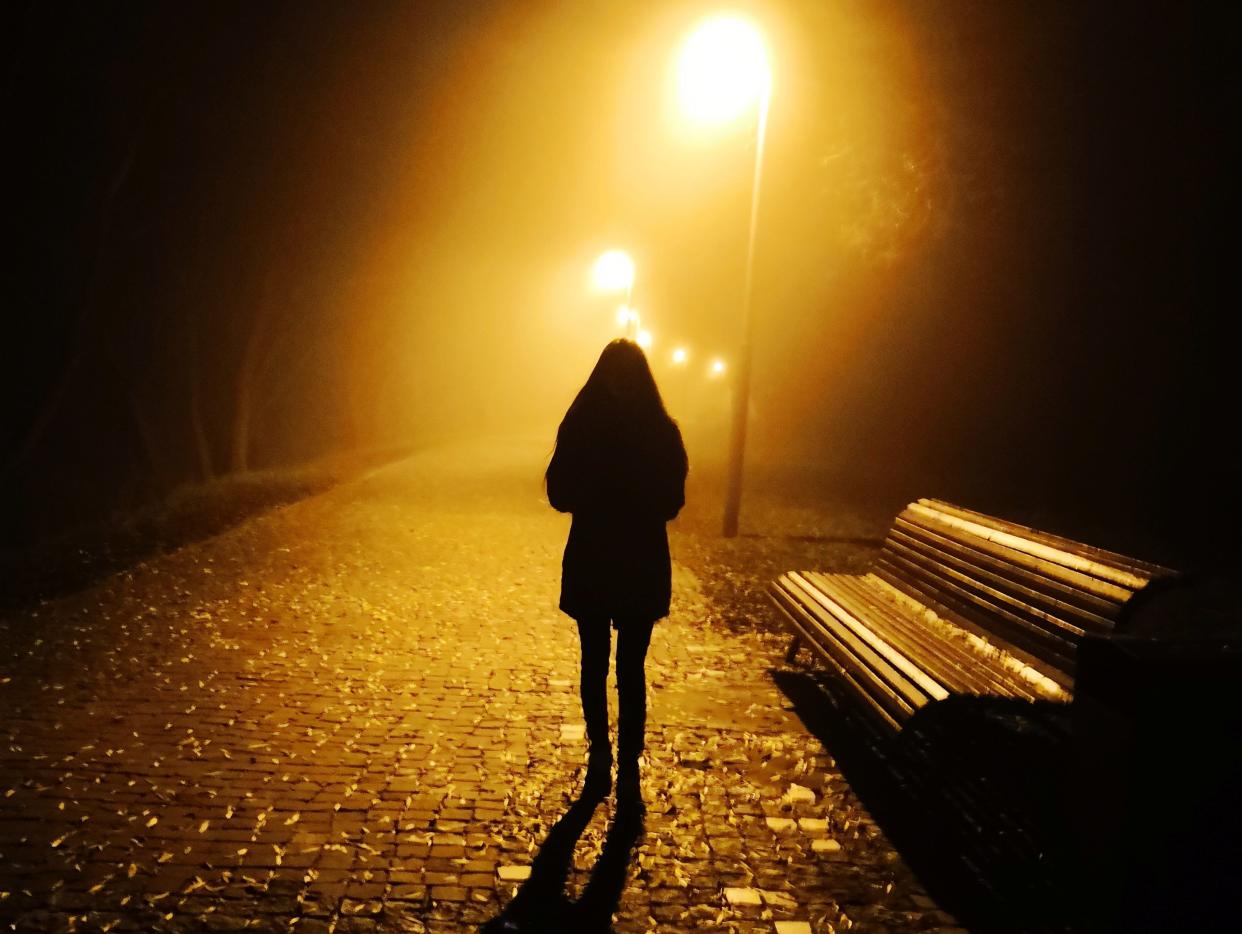 woman walking at night