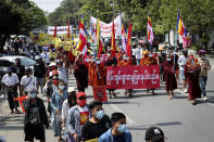 Buddhist monks holding signs and banners lead an anti-coup protest march in Mandalay, Myanmar, Monday, March 1, 2021. Police in Myanmar’s biggest city of Yangon on Monday fired tear gas at defiant crowds who returned to the streets to protest the military’s seizure of power a month ago, despite reports that security forces had killed at least 18 people around the country a day earlier. (AP Photo)