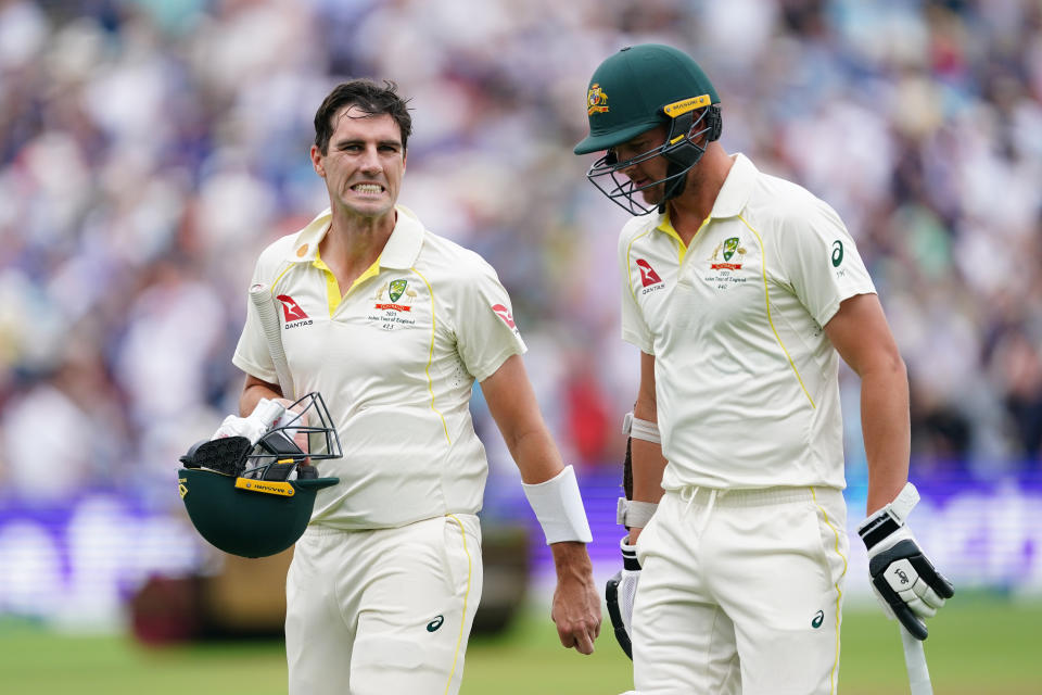 Pat Cummins and Josh Hazlewood walk off the field after the innings.