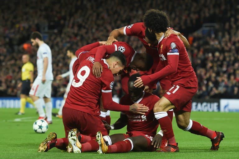 Liverpool's Sadio Mane (C) celebrates scoring their fourth goal during their match against Spartak Moscow in Liverpool, north-west England on December 6, 2017