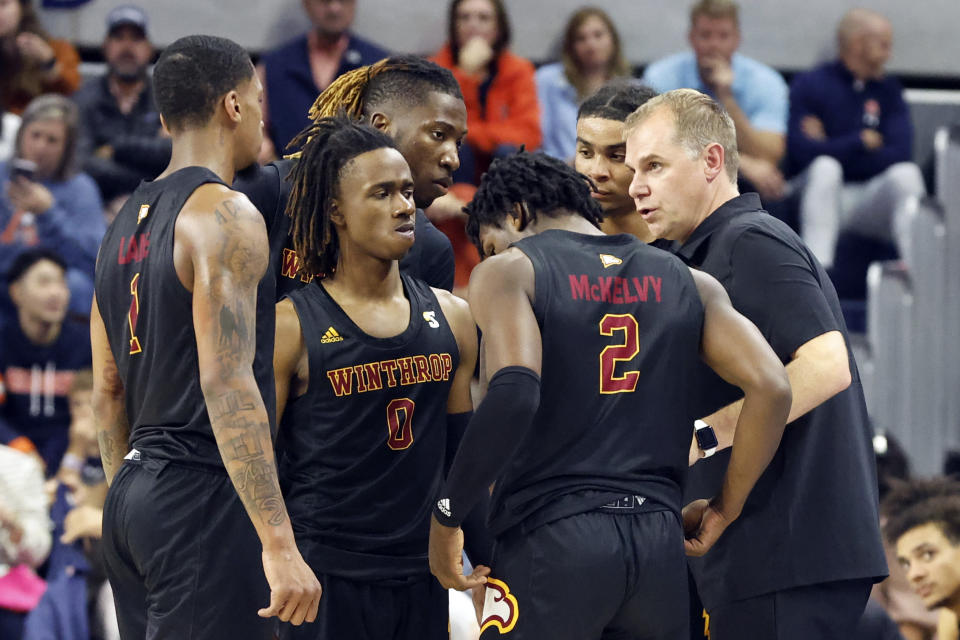 Winthrop coach Mark Prosser talks to players during the second half of the team's NCAA college basketball game against Auburn on Tuesday, Nov. 15, 2022, in Auburn, Ala. (AP Photo/Butch Dill)