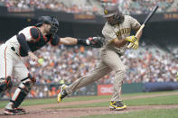 San Francisco Giants catcher Curt Casali, left, reaches to tag San Diego Padres' Nabil Crismatt after Crismatt struck out during the fourth inning of a baseball game in San Francisco, Thursday, Sept. 16, 2021. (AP Photo/Jeff Chiu)