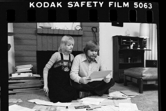 George Lee and Kathleen Lutz sit and read documents of their Amityville home.