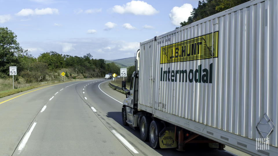 A J.B. Hunt intermodal container being pulled on a highway