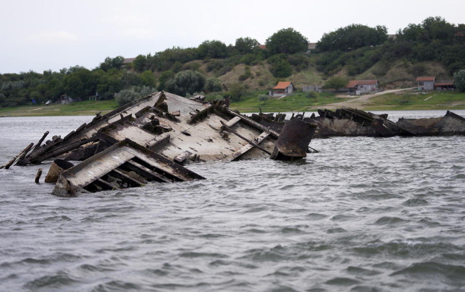 The wreckage of a WWII German warship is seen in the Danube river near Prahovo, Serbia, Monday, Aug. 29, 2022. The worst drought in Europe in decades has not only scorched farmland and hampered river traffic, it also has exposed a part of World War II history that had almost been forgotten. The hulks of dozens of German battleships have emerged from the mighty Danube River as its water levels dropped. (AP Photo/Darko Vojinovic)