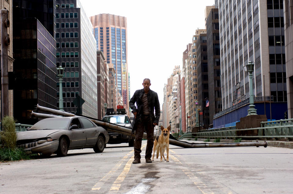 Will Smith and a dog walk in the street