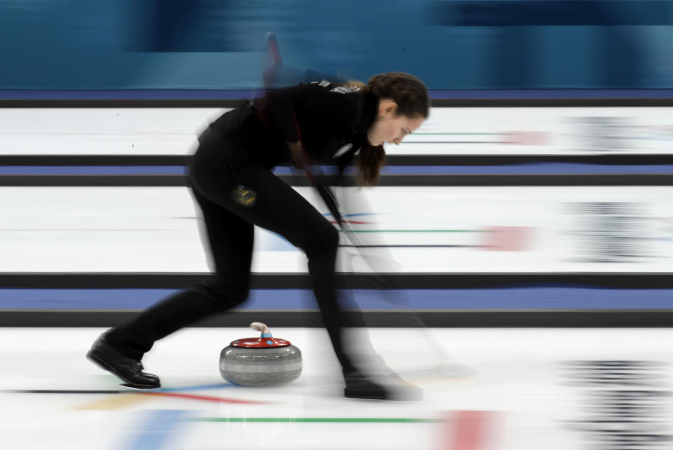 <p>Olympic Athlete from Russia Anastasia Bryzgalova sweeps ice during their mixed doubles curling match against Norway at the 2018 Winter Olympics in Gangneung, South Korea, Thursday, Feb. 8, 2018. (AP Photo/Aaron Favila) </p>