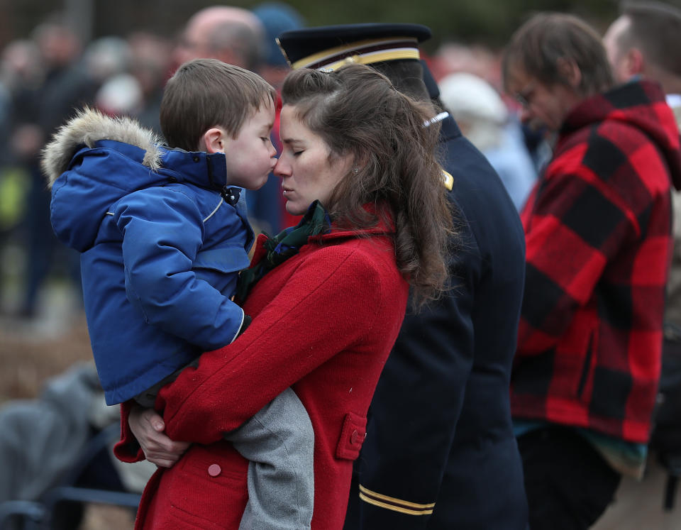 Tristan LaFlame, 4, kisses his mother, Elizabeth LaFlame, whose husband serves in the New Hampshire National Guard as they listen to the invocation during a Veterans Day ceremony at the New Hampshire State Veterans cemetery on Nov. 11, 2019 in Boscawen, New Hampshire. (Photo: Joe Raedle/Getty Images)