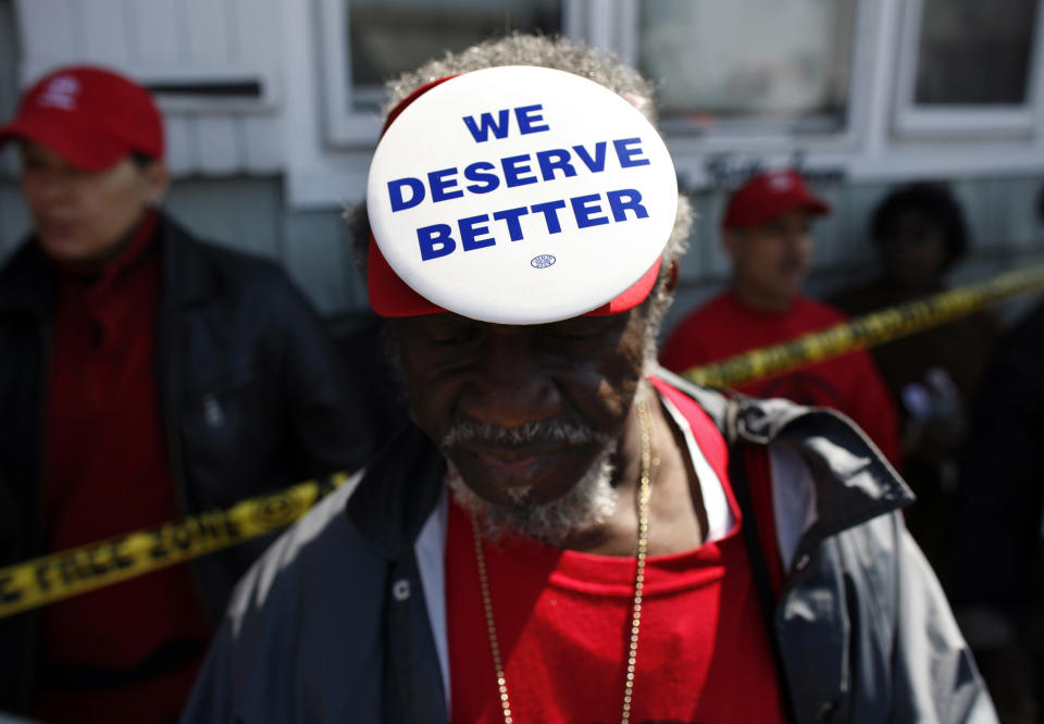 Demonstrators from ACORN's Home Defenders rally outside the foreclosed home of Marie Elie in Elmont, New York, April 9, 2009. REUTERS/Shannon Stapleton 