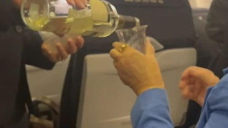 Passengers left to drink wine on stranded Qantas flight. Picture: Nine