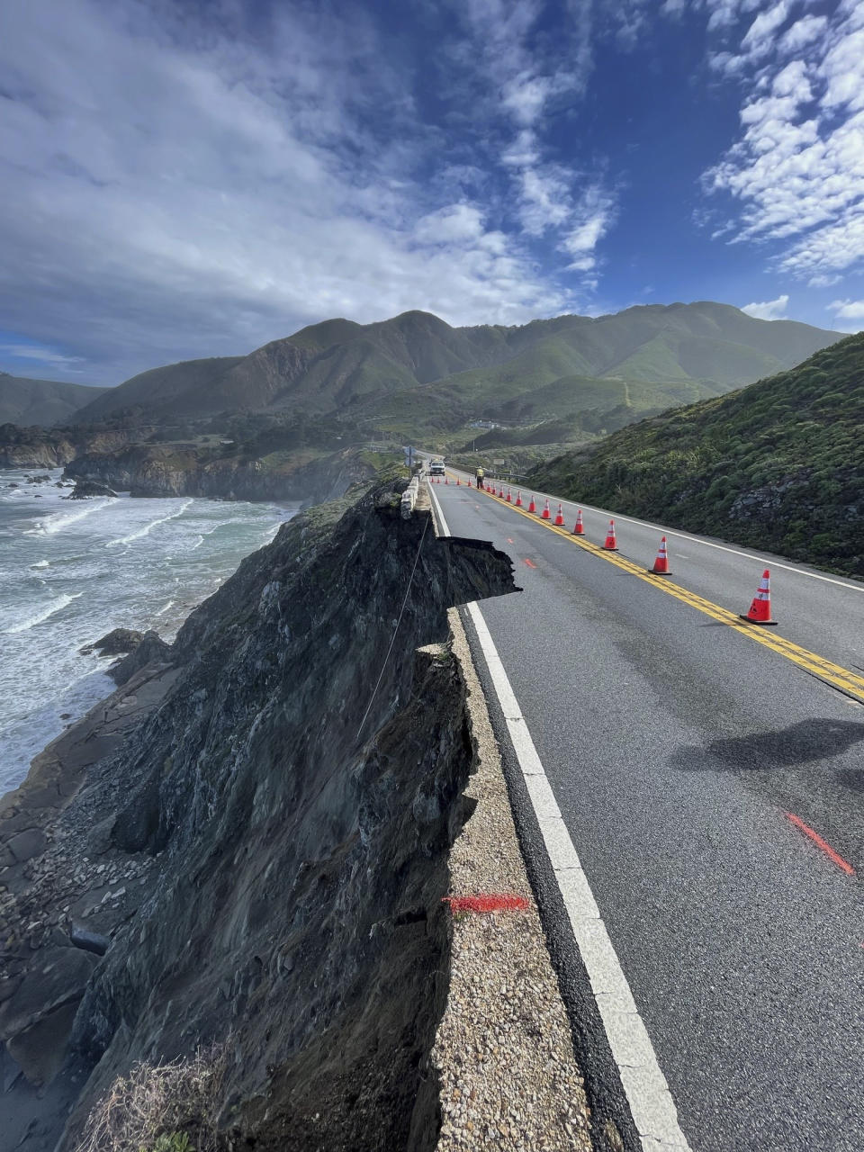 This photo provided by Caltrans shows a damaged section of Highway 1, Sunday, March 31, 2024, south of Rocky Creek Bridge in Big Sur, Calif. Authorities urged motorists to avoid the scenic highway after a section of the coastal route collapsed during an Easter weekend storm, forcing closures and stranding motorists near Big Sur, authorities said. (Caltrans District 5 via AP)