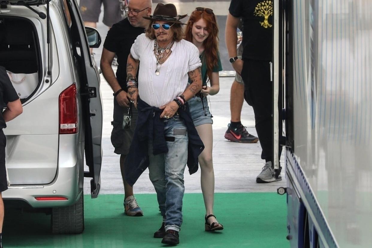 *PREMIUM-EXCLUSIVE* Perugia, ITALY - Johnny Depp is seen arriving with a pretty young red-haired woman to rehearsal at the Arena Santa Giuliana today