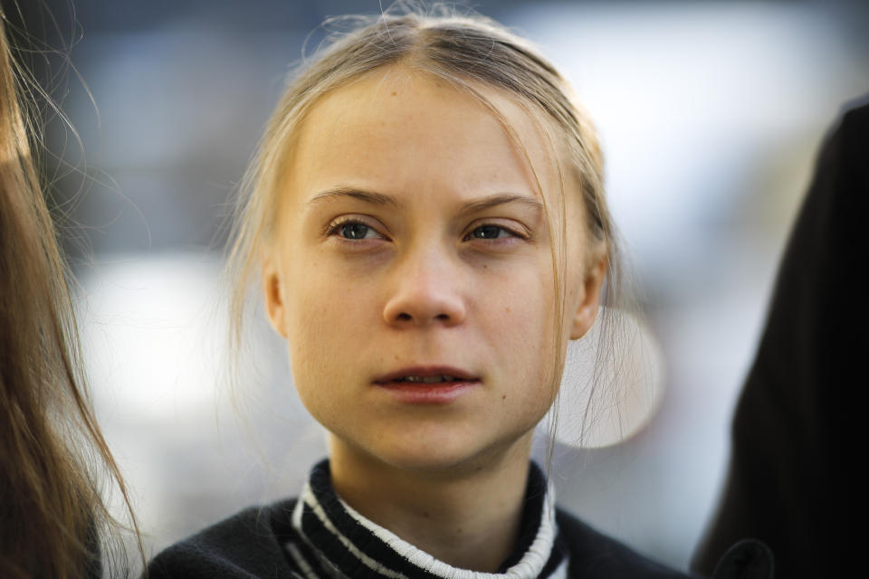 Swedish climate activist Greta Thunberg poses for media as she arrives for a news conference in Davos, Switzerland, Friday, Jan. 24, 2020. The 50th annual meeting of the forum is taking place in Davos from Jan. 21 until Jan. 24, 2020 (AP Photo/Markus Schreiber)