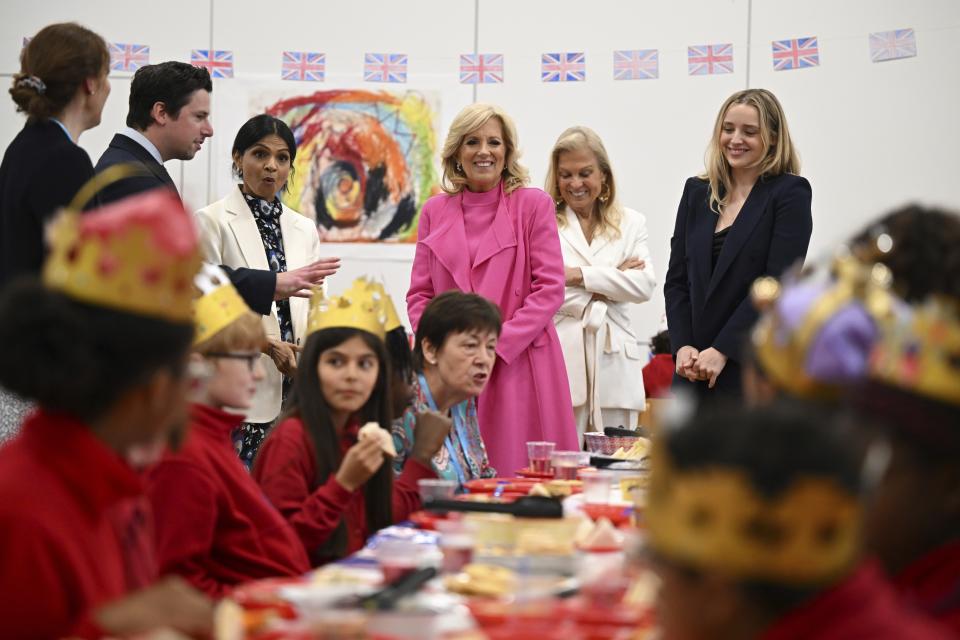 US First Lady Jill Biden, center, and Akshata Murty, wife of Britain's Prime Minster, third left, her grand daughter Finnegan Biden, right, visit the Charles Dickens Primary School in London, Friday May 5, 2023. (Oli Scarff/Pool Photo via AP)