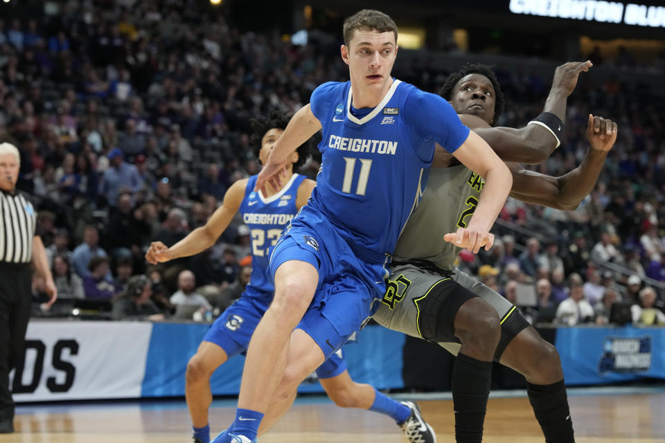 FILE - Creighton center Ryan Kalkbrenner (11) works around Baylor forward Jonathan Tchamwa Tchatchoua during the first half of a second-round game in the NCAA men's college basketball tournament March 19, 2023, in Denver. The 7-foot-1 Kalkbrenner is one of the top centers in the country. He shot 69.5% from the field and led the Bluejays with 15.9 points per game. (AP Photo/David Zalubowski, File)