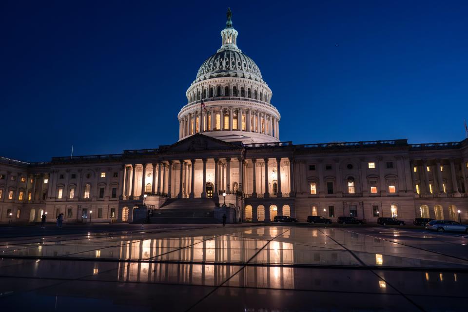 Days away from a default crisis, the Capitol is illuminated as the Senate works into the night to finish votes on amendments on the big debt ceiling and budget cuts package, at the Capitol in Washington, Thursday evening, June 1, 2023. (AP Photo/J. Scott Applewhite)
